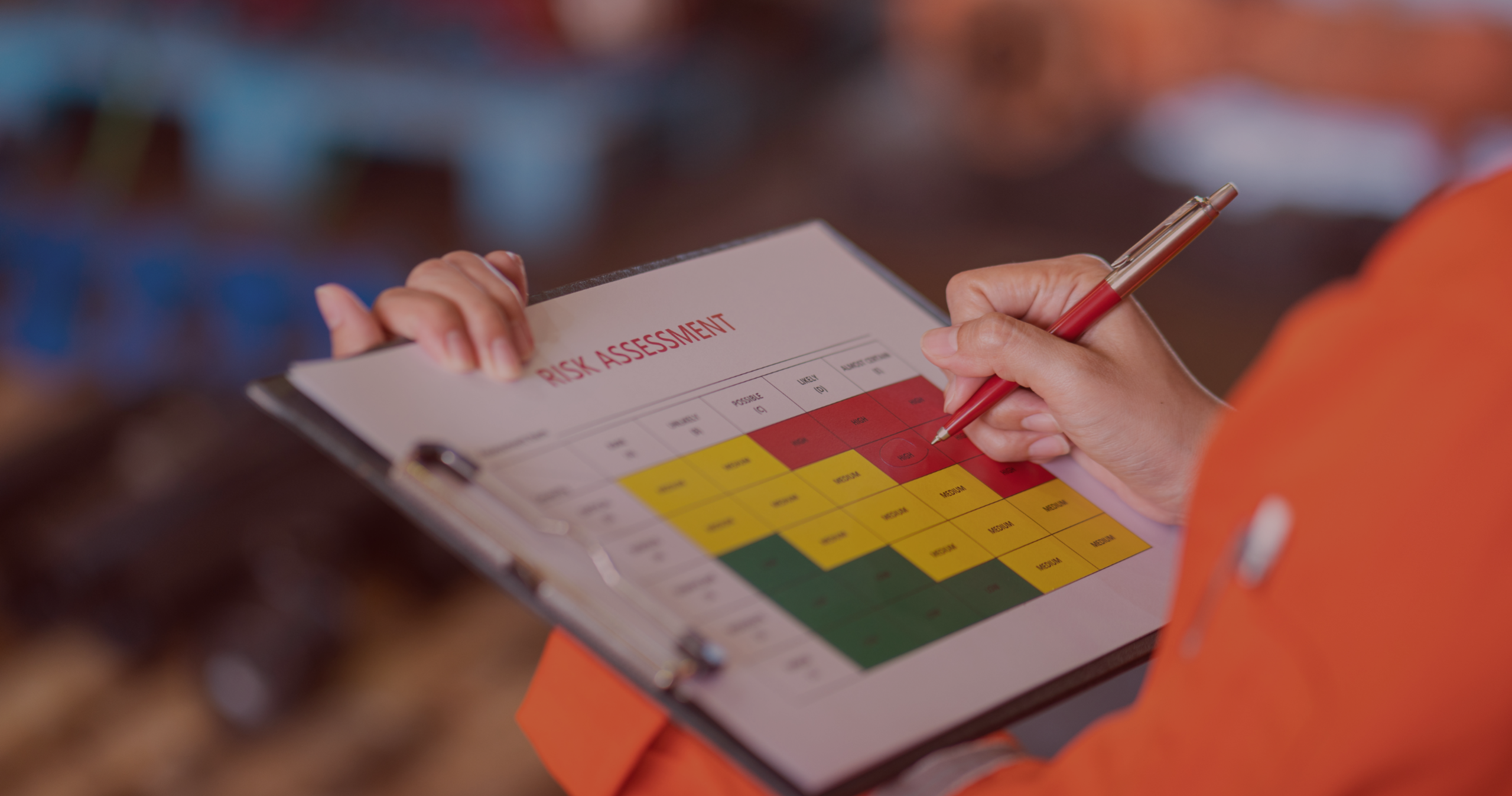 DALA Insights_Fire Risk Assessment Assessor completing a fire risk assessment risk rating matrix on a clipboard